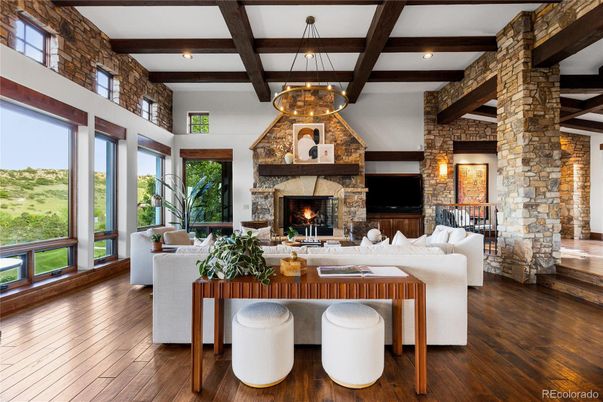 Chandelier, Fireplace, Interior, Living room, Recessed Lighting, Stone Walls, Wooden Beams, Wood Texture Flooring