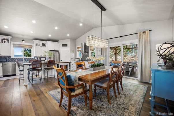 Chandelier, Dining room, Interior, Kitchen, Pendant Lights, Recessed Lighting, Stainless Steel Appliances, Wood Texture Flooring