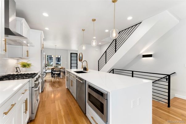 Dining room, Interior, Kitchen, Pendant Lights, Recessed Lighting, Stainless Steel Appliances, Wood Texture Flooring