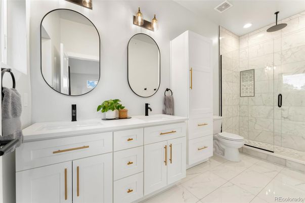 Bathroom, Dual Sink Vanities, Glass Shower, Interior, Marble, Marble Walls, Recessed Lighting