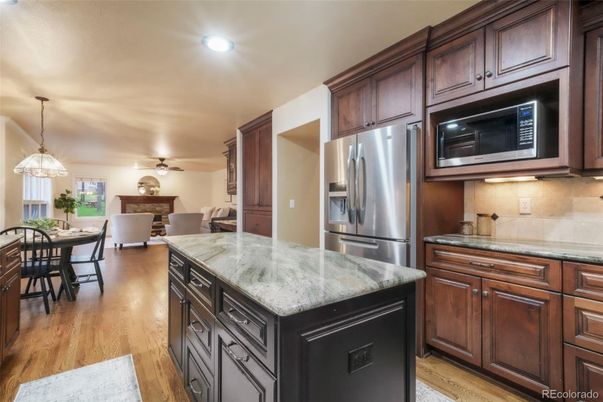 Dining room, Interior, Kitchen, Pendant Lights, Recessed Lighting, Stainless Steel Appliances, Wood Texture Flooring