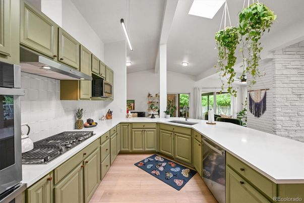 Interior, Kitchen, Pendant Lights, Recessed Lighting, Stainless Steel Appliances, Stone Walls, Wood Texture Flooring