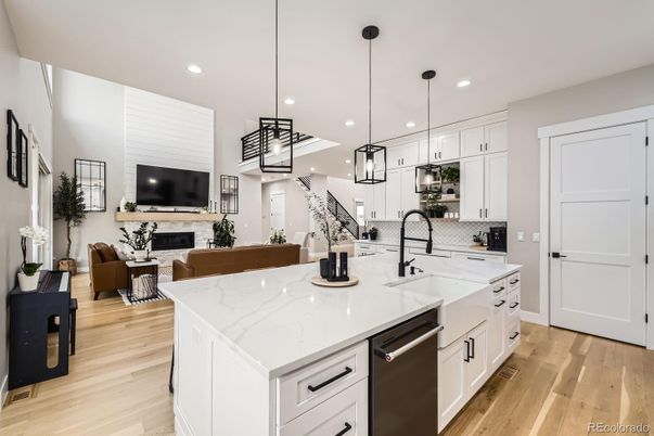 Fireplace, Interior, Kitchen, Living room, Pendant Lights, Recessed Lighting, Stainless Steel Appliances, Wood Texture Flooring