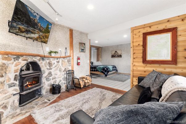 Fireplace, Interior, Living room, Recessed Lighting, Wood Texture Flooring, Wooden Walls