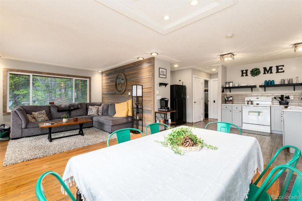 Dining room, Interior, Kitchen, Living room, Recessed Lighting, Washer, Wood Texture Flooring