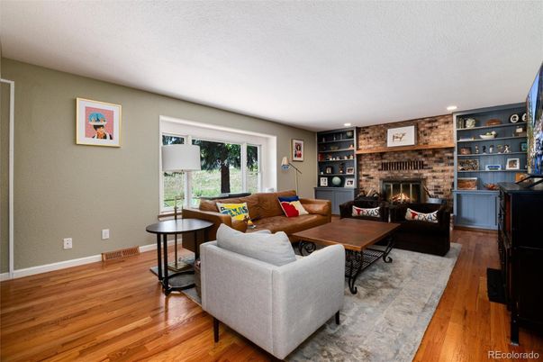 Fireplace, Interior, Living room, Recessed Lighting, Stone Walls, Wood Texture Flooring