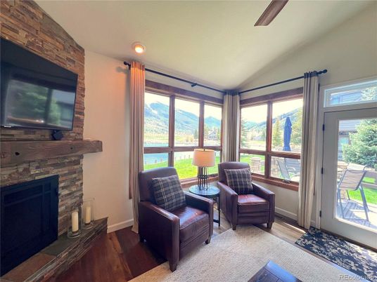 Fireplace, Interior, Stone Walls, Sun Room, Wood Texture Flooring