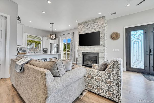 Fireplace, Interior, Living room, Pendant Lights, Recessed Lighting, Stone Walls, Wood Texture Flooring