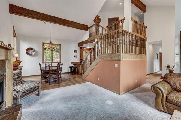 Chandelier, Dining room, Fireplace, Interior, Pendant Lights, Recessed Lighting, Wooden Beams, Wood Texture Flooring
