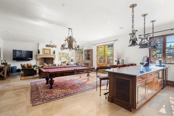 Billiard Table, Chandelier, Fireplace, Game Room, Interior, Living room, Pendant Lights, Recessed Lighting