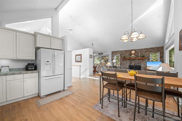 Dining room, Fireplace, Interior, Kitchen, Pendant Lights, Stone Walls, Wood Texture Flooring