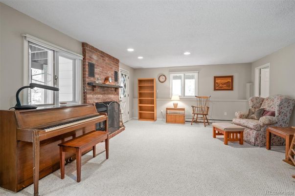 Fireplace, Interior, Living room, Piano, Recessed Lighting, Stone Walls