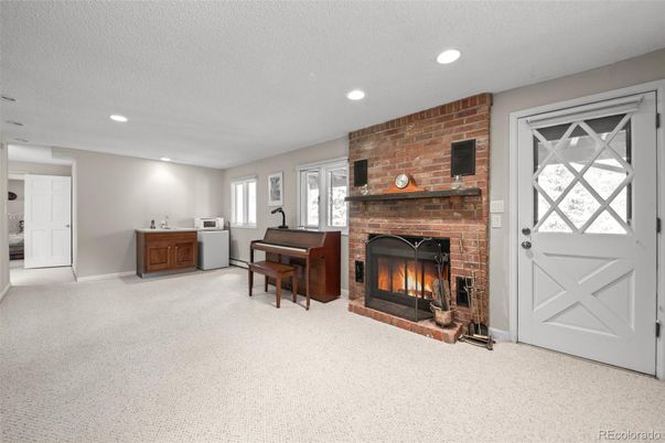 Fireplace, Interior, Piano, Recessed Lighting, Stone Walls