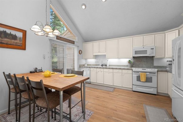 Dining room, Interior, Kitchen, Pendant Lights, Recessed Lighting, Stainless Steel Appliances, Wood Texture Flooring