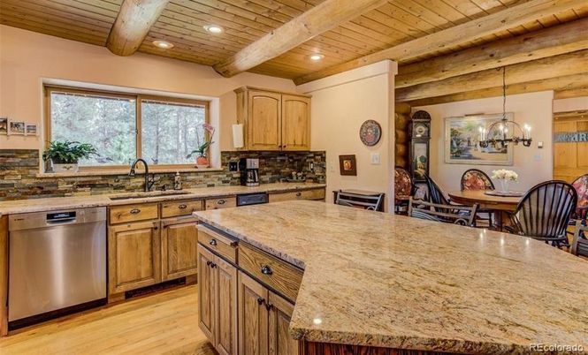 Chandelier, Dining room, Interior, Kitchen, Pendant Lights, Recessed Lighting, Stainless Steel Appliances, Wooden Beams, Wooden Ceilings, Wood Texture Flooring