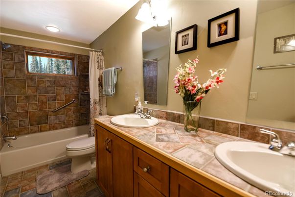 Bathroom, Dual Sink Vanities, Interior, Recessed Lighting, Tile Countertops