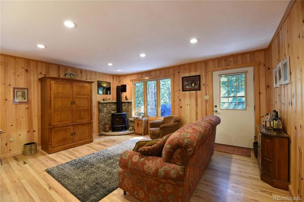 Fireplace, Interior, Living room, Recessed Lighting, Wood Texture Flooring, Wooden Walls