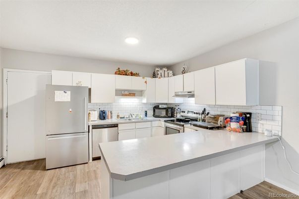 Interior, Kitchen, Recessed Lighting, Stainless Steel Appliances, Wood Texture Flooring