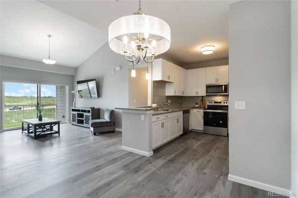 Chandelier, Interior, Kitchen, Pendant Lights, Stainless Steel Appliances, Wood Texture Flooring