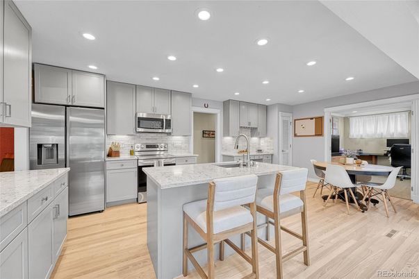 Dining room, Interior, Kitchen, Recessed Lighting, Stainless Steel Appliances, Wood Texture Flooring