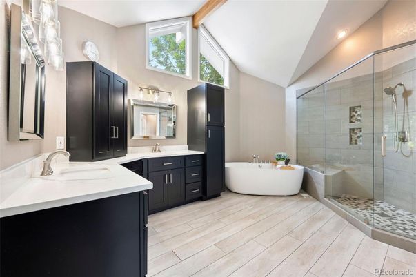Bathroom, Dual Sink Vanities, Free Standing Baths, Glass Shower, Interior, Recessed Lighting, Wood Texture Flooring