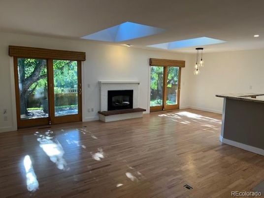 Empty room, Fireplace, Interior, Pendant Lights, Recessed Lighting, Wood Texture Flooring