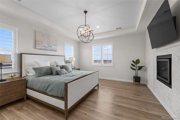 Bedroom, Fireplace, Interior, Pendant Lights, Recessed Lighting, Wood Texture Flooring