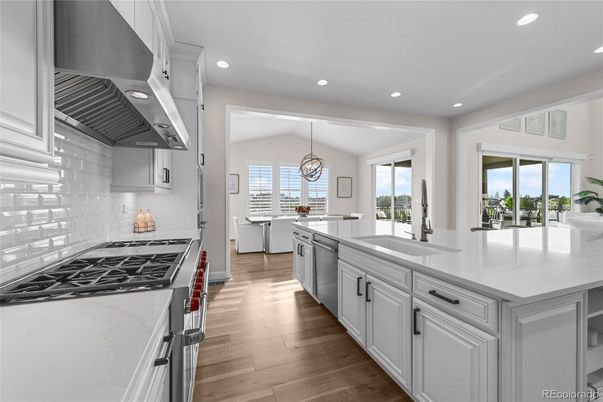 Chandelier, Interior, Kitchen, Pendant Lights, Recessed Lighting, Stainless Steel Appliances, Wood Texture Flooring