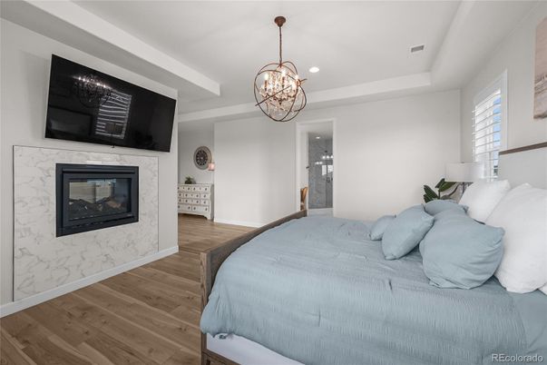 Bedroom, Chandelier, Fireplace, Interior, Pendant Lights, Recessed Lighting, Wood Texture Flooring