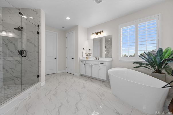 Bathroom, Dual Sink Vanities, Free Standing Baths, Glass Shower, Interior, Marble, Marble Walls, Recessed Lighting