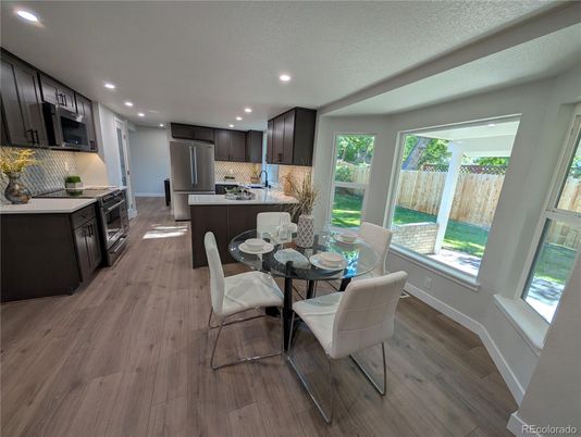 Dining room, Interior, Kitchen, Recessed Lighting, Stainless Steel Appliances, Wood Texture Flooring