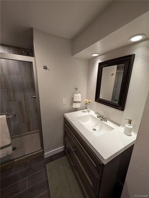 Bathroom, Dual Sink Vanities, Glass Shower, Interior, Recessed Lighting, Wood Texture Flooring