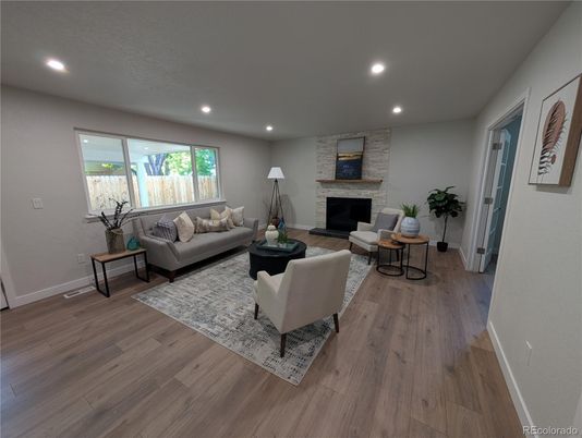 Fireplace, Interior, Living room, Recessed Lighting, Stone Walls, Wood Texture Flooring