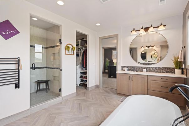 Bathroom, Dual Sink Vanities, Free Standing Baths, Glass Shower, Interior, Recessed Lighting, Walk-in Closets, Wood Texture Flooring
