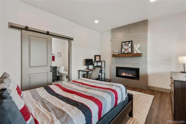 Bedroom, Fireplace, Interior, Recessed Lighting, Wood Texture Flooring