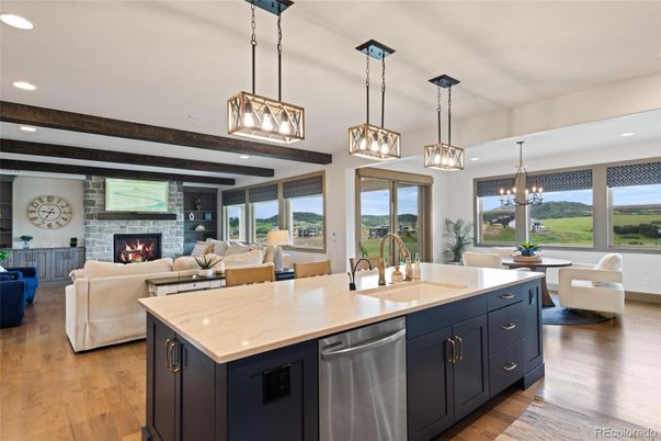 Dining room, Fireplace, Interior, Kitchen, Living room, Pendant Lights, Recessed Lighting, Stainless Steel Appliances, Stone Walls, Wood Texture Flooring