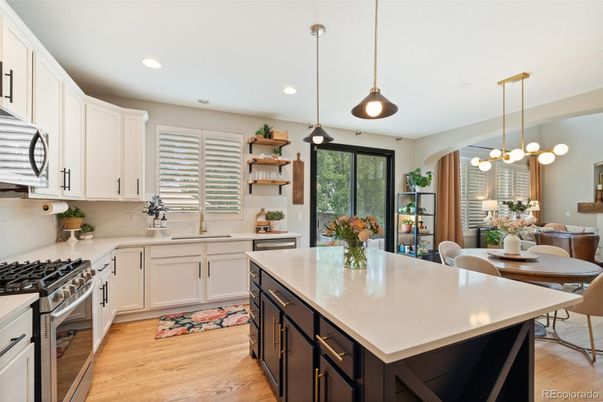 Dining room, Interior, Kitchen, Pendant Lights, Recessed Lighting, Stainless Steel Appliances, Wood Texture Flooring