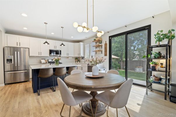 Dining room, Interior, Kitchen, Pendant Lights, Recessed Lighting, Stainless Steel Appliances, Wood Texture Flooring