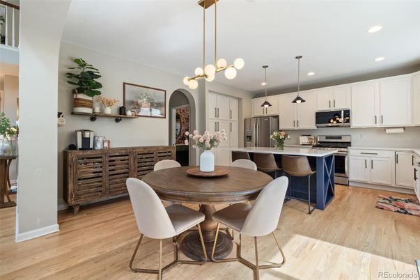 Dining room, Interior, Kitchen, Pendant Lights, Recessed Lighting, Stainless Steel Appliances, Wood Texture Flooring