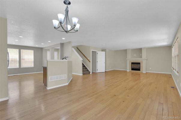 Chandelier, Empty room, Fireplace, Interior, Recessed Lighting, Wood Texture Flooring