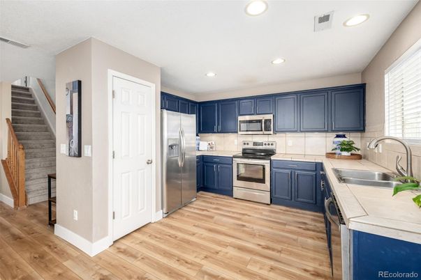 Interior, Kitchen, Recessed Lighting, Stainless Steel Appliances, Wood Texture Flooring