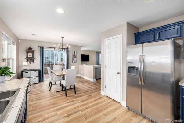 Dining room, Interior, Kitchen, Pendant Lights, Recessed Lighting, Stainless Steel Appliances, Wood Texture Flooring