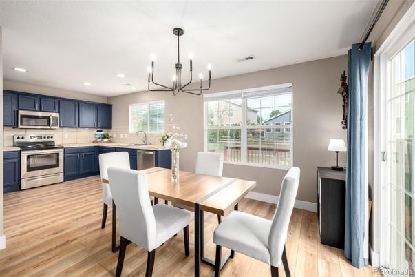 Chandelier, Dining room, Interior, Kitchen, Pendant Lights, Recessed Lighting, Stainless Steel Appliances, Wood Texture Flooring