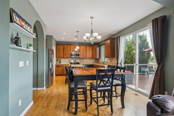 Chandelier, Dining room, Interior, Kitchen, Pendant Lights, Recessed Lighting, Stainless Steel Appliances, Wood Texture Flooring