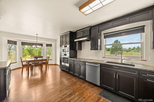 Dining room, Interior, Kitchen, Pendant Lights, Stainless Steel Appliances, Wood Texture Flooring