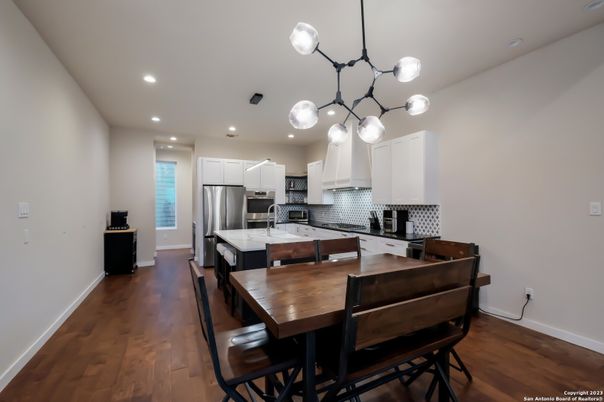 Dining room, Interior, Kitchen, Pendant Lights, Recessed Lighting, Stainless Steel Appliances, Wood Texture Flooring