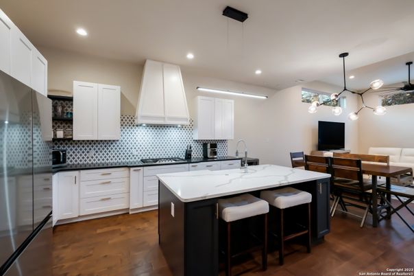 Dining room, Interior, Kitchen, Pendant Lights, Recessed Lighting, Stainless Steel Appliances, Wood Texture Flooring
