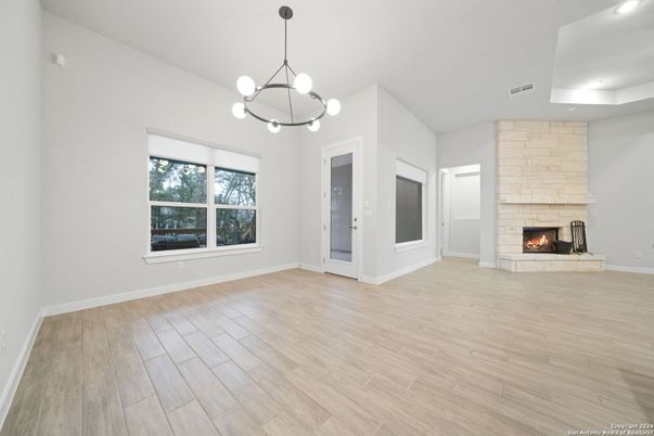 Empty room, Fireplace, Interior, Pendant Lights, Recessed Lighting, Wood Texture Flooring