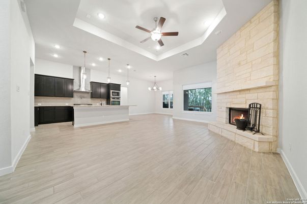 Fireplace, Interior, Kitchen, Pendant Lights, Recessed Lighting, Stone Walls, Wood Texture Flooring