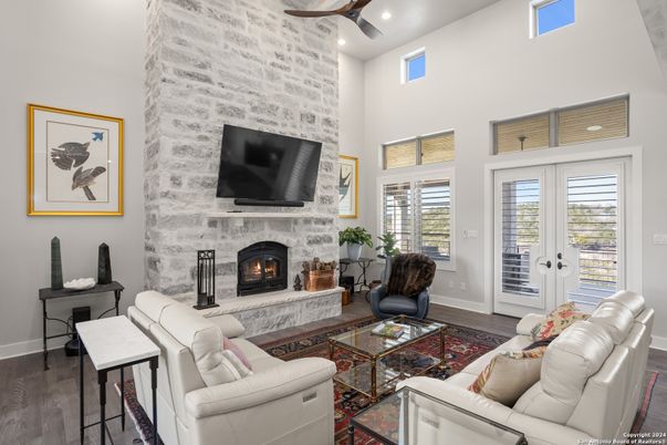 Fireplace, Interior, Living room, Recessed Lighting, Stone Walls, Wood Texture Flooring
